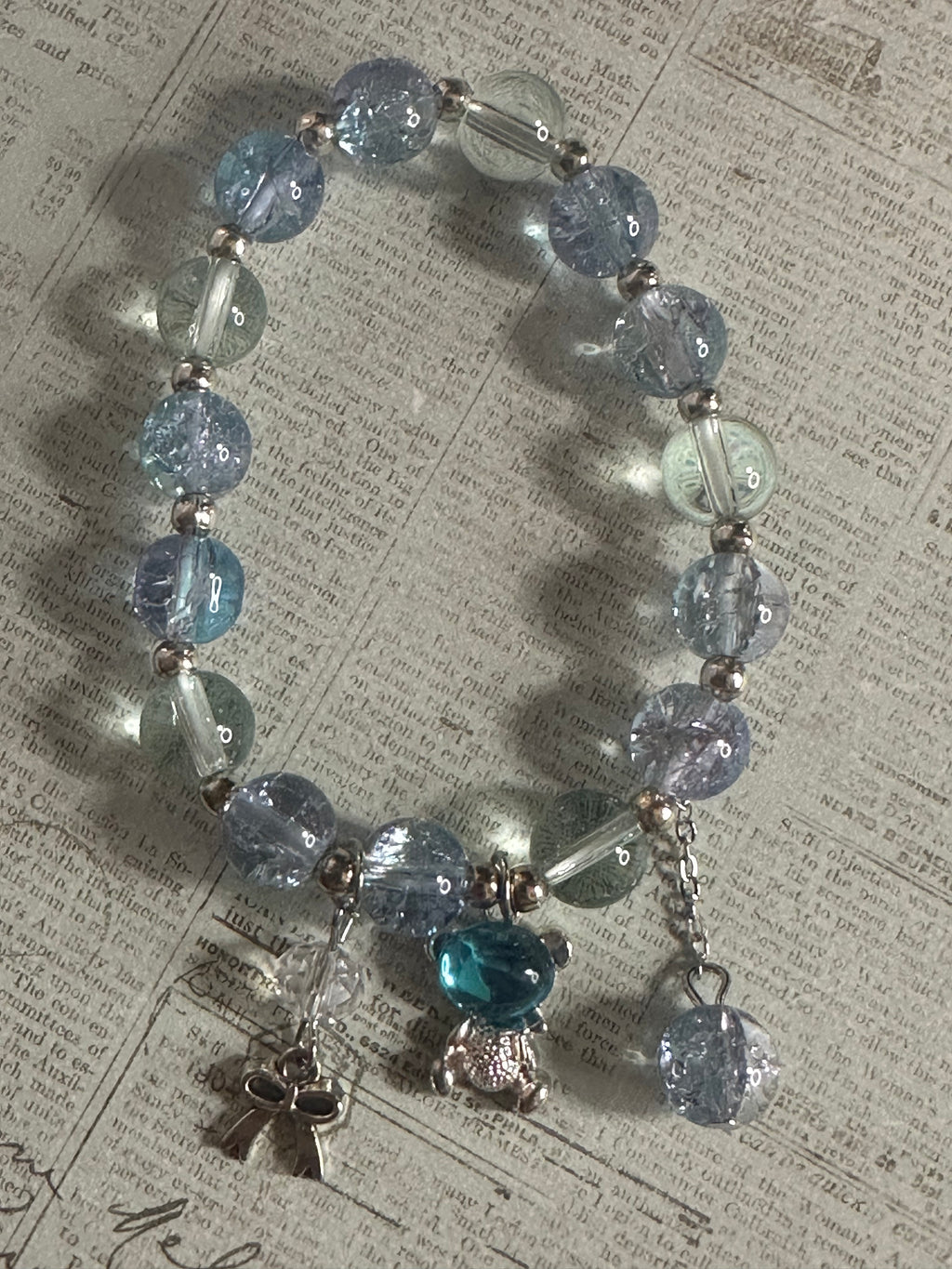 Blue Glass Bead Bracelet with Charms and Dangles