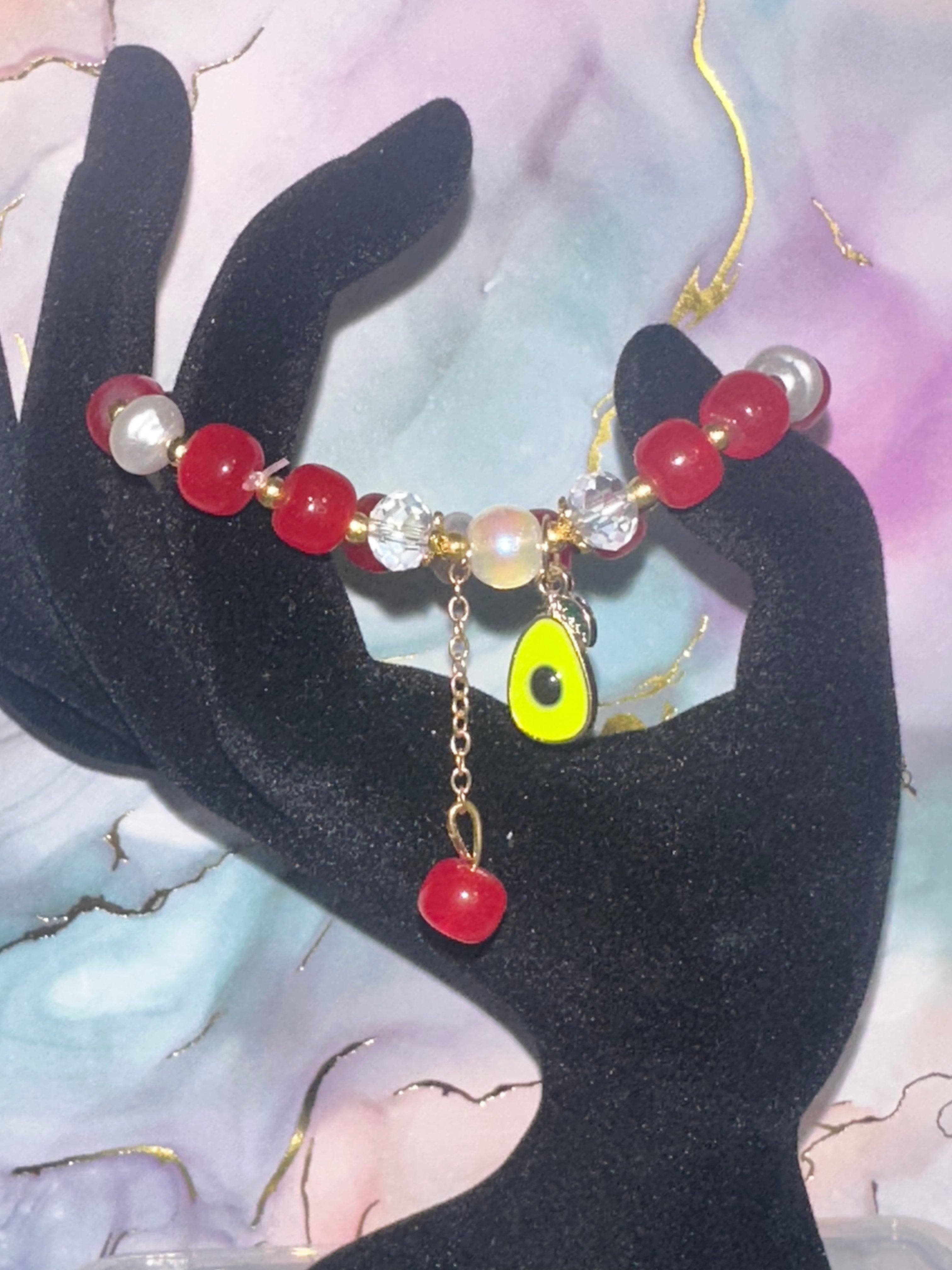 Red and White Glass Bead Bracelet with Avocado Charm