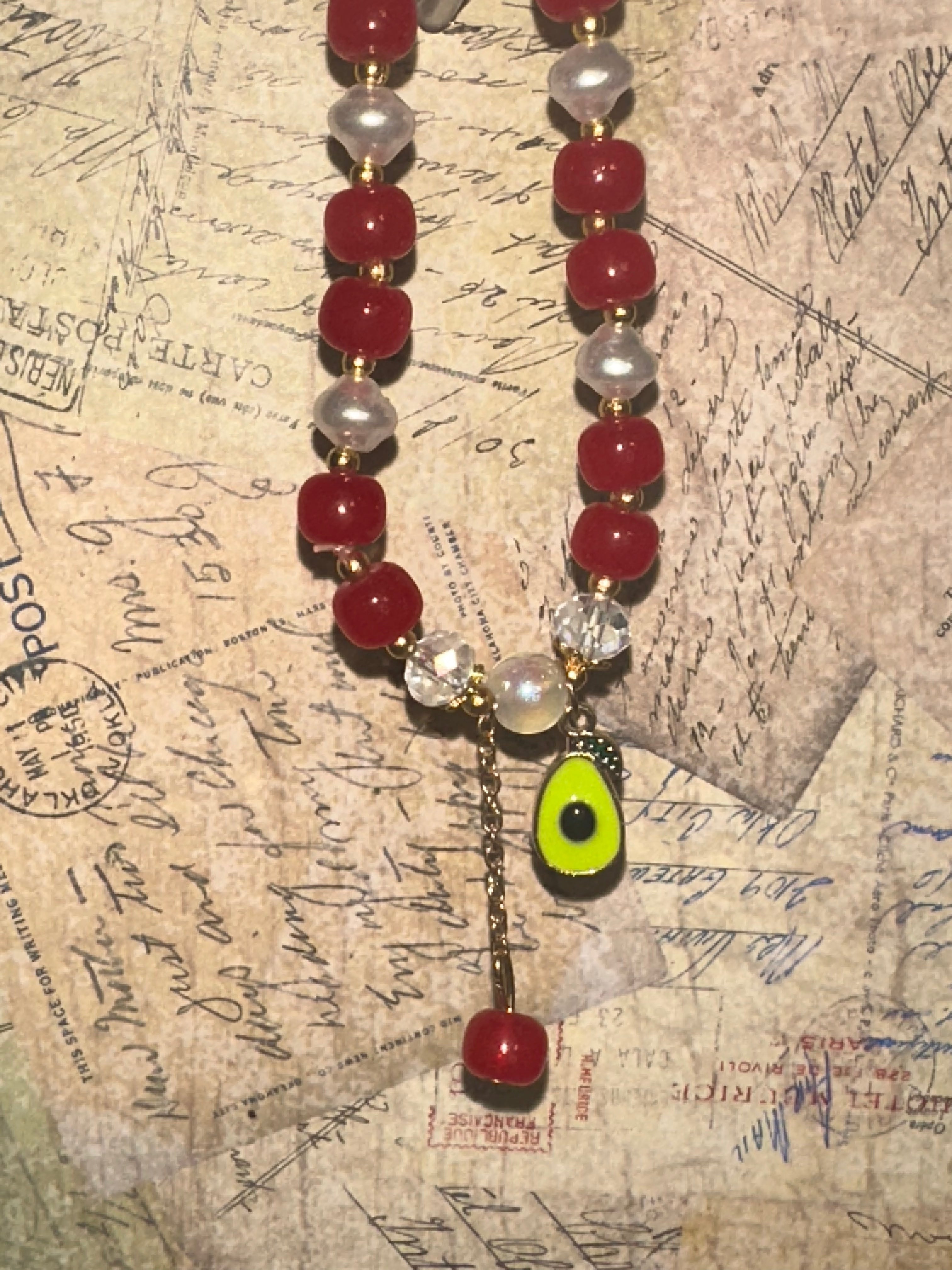 Red and White Glass Bead Bracelet with Avocado Charm